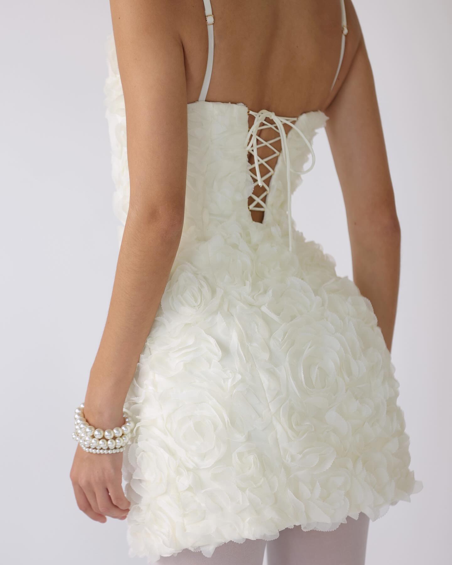 Christina® | Mini dress with corset and floral appliqués in white