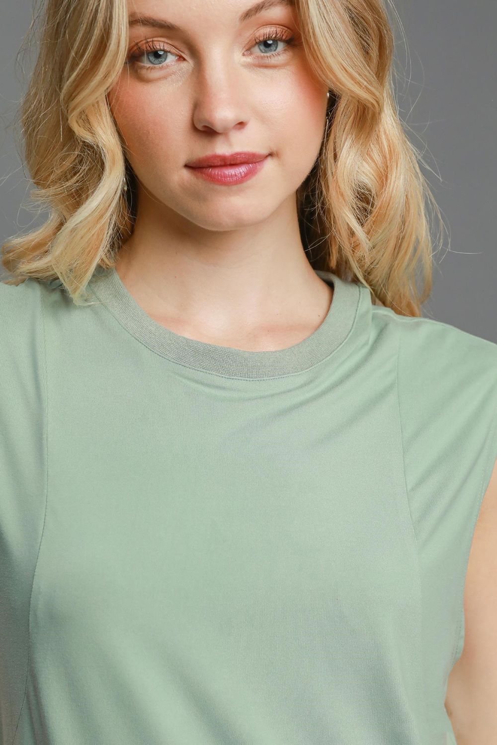 Bella® | Sleeveless mini dress with a round neckline and a high, low, curved hem