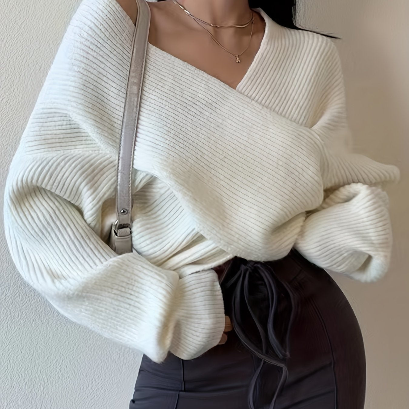 Elda® | Solid knit sweater with a wrap front