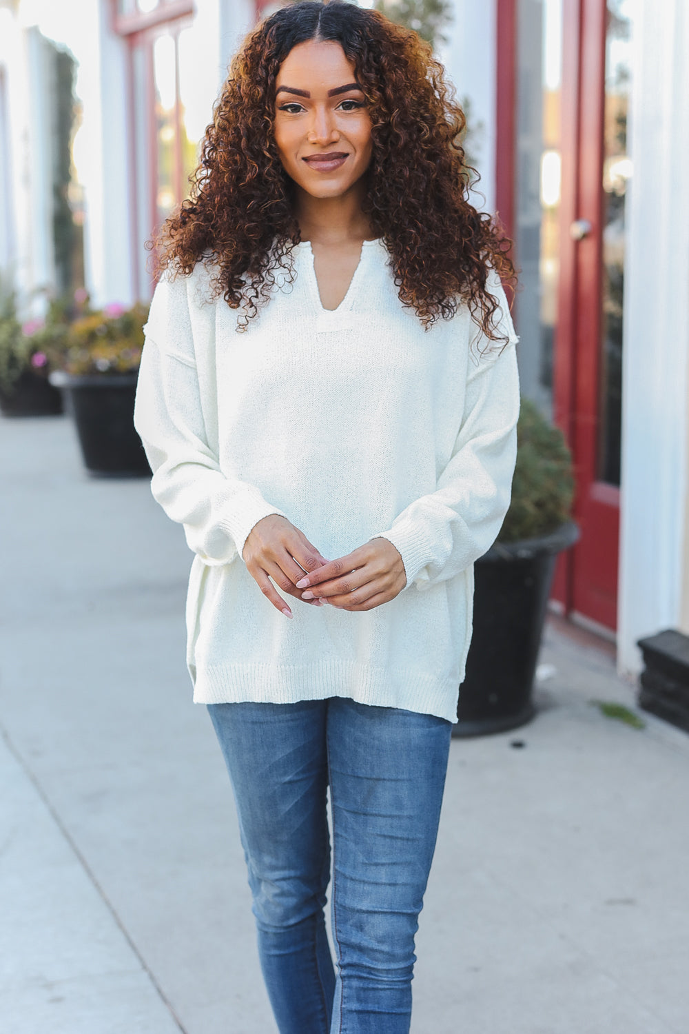 Avis® | Lock Eyes Ivory oversized sweater with notched neckline and patch