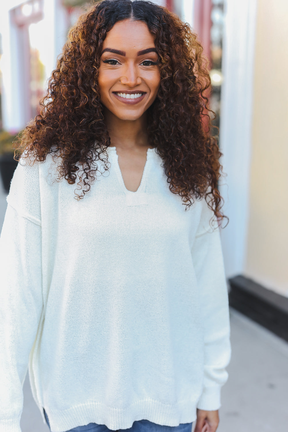 Avis® | Lock Eyes Ivory oversized sweater with notched neckline and patch