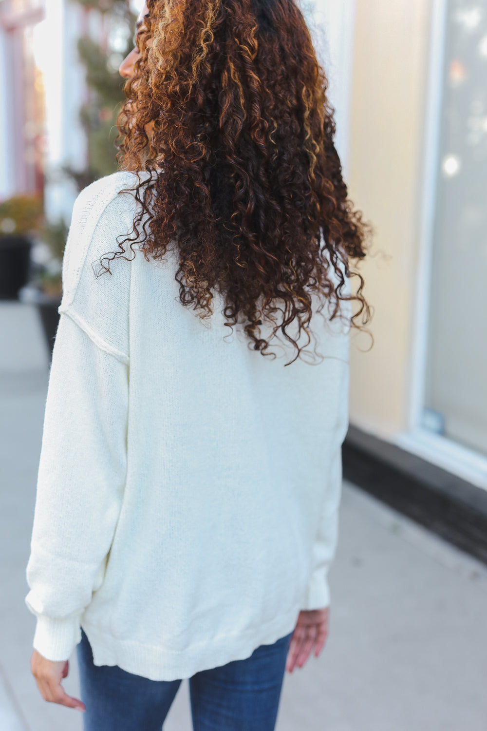 Avis® | Lock Eyes Ivory oversized sweater with notched neckline and patch