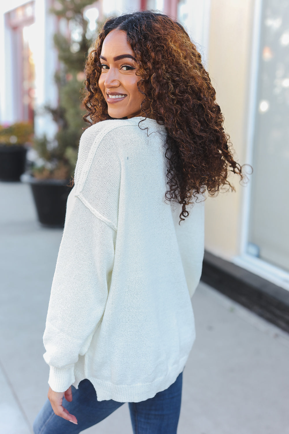 Avis® | Lock Eyes Ivory oversized sweater with notched neckline and patch