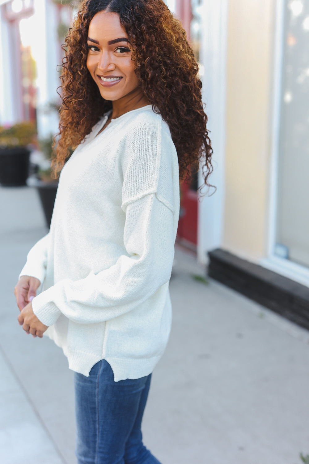 Avis® | Lock Eyes Ivory oversized sweater with notched neckline and patch