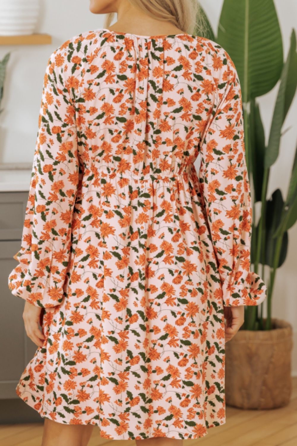 Amparo® | Smocked printed long sleeve dress with V-neck