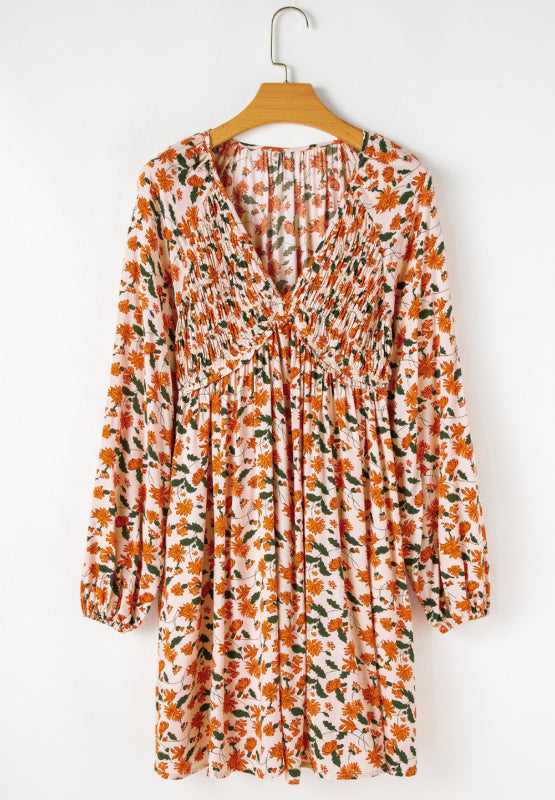 Amparo® | Smocked printed long sleeve dress with V-neck