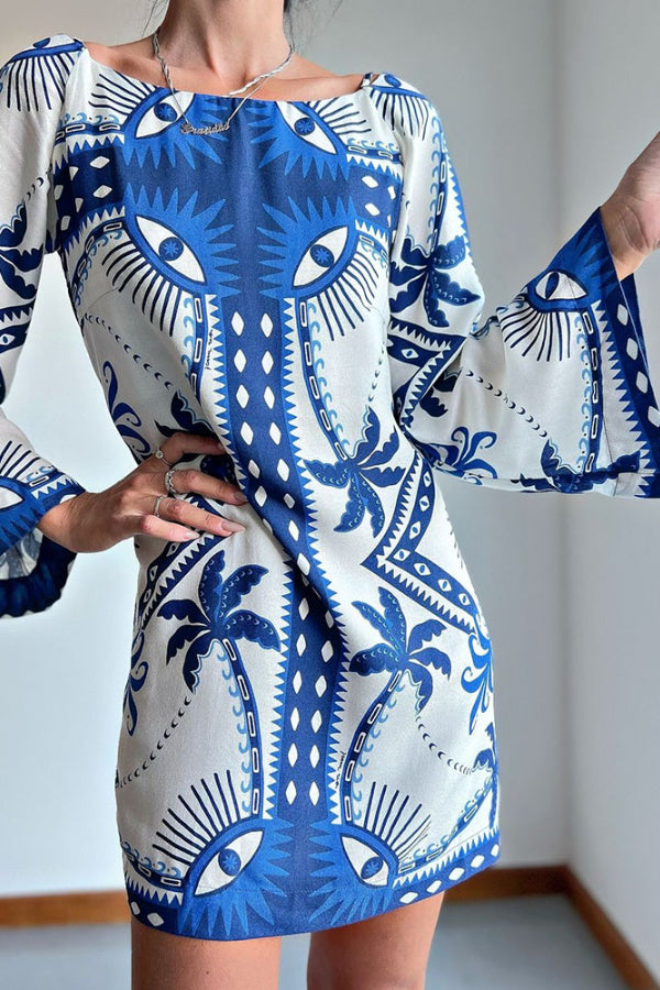 Ava® | Blue mini dress with Mysterious Eyes print