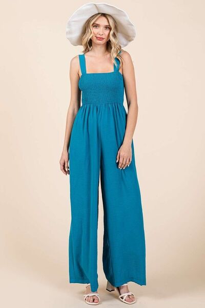 Alina® | Smocked jumpsuit with wide straps and wide legs