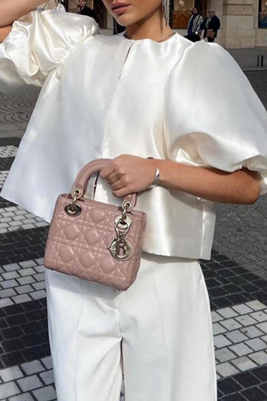 Claudia® | Elegant solid color O-neck tops from celebrities