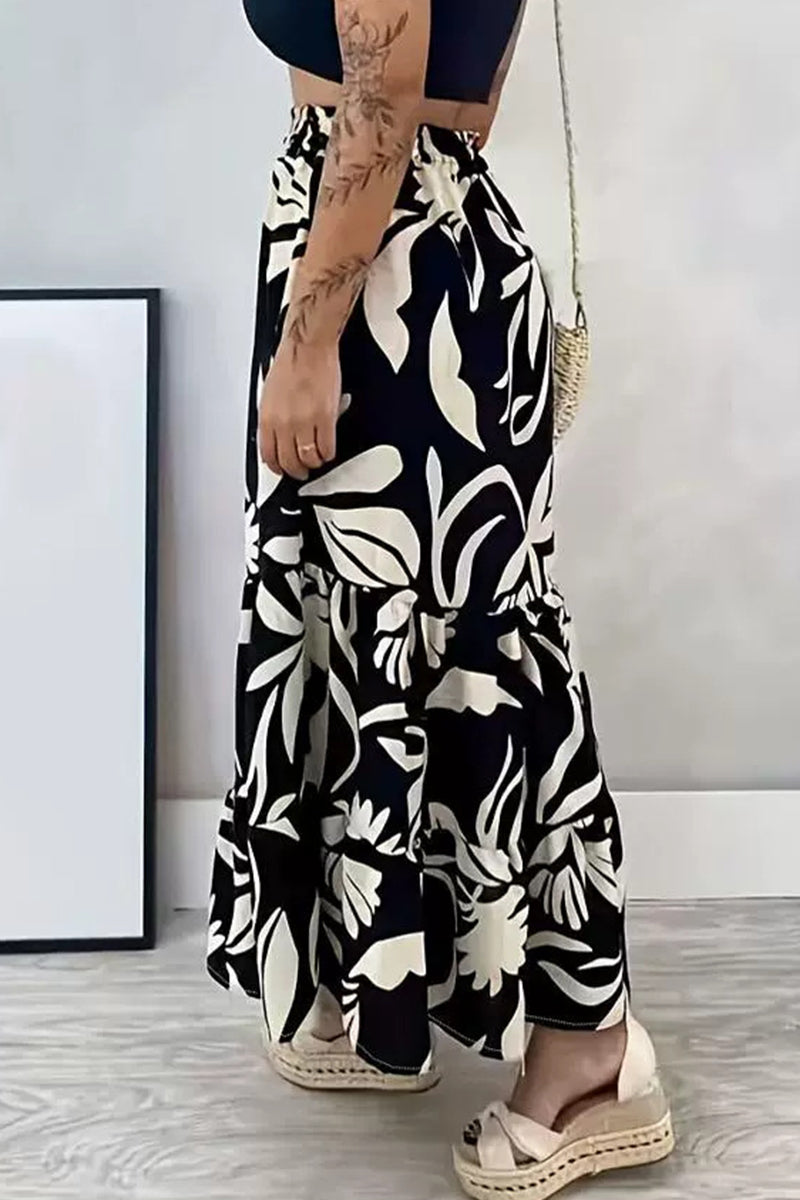 Claudia® | Elegant, loose, floral frenulum type A trousers with an all-over print