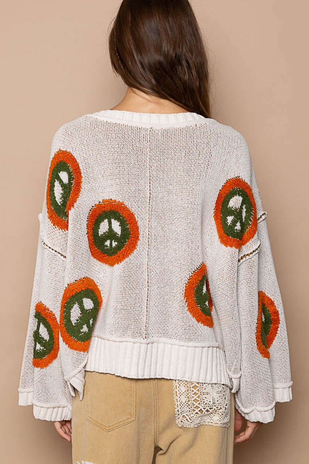 Anya® | Long sleeve peace print V-neck sweater