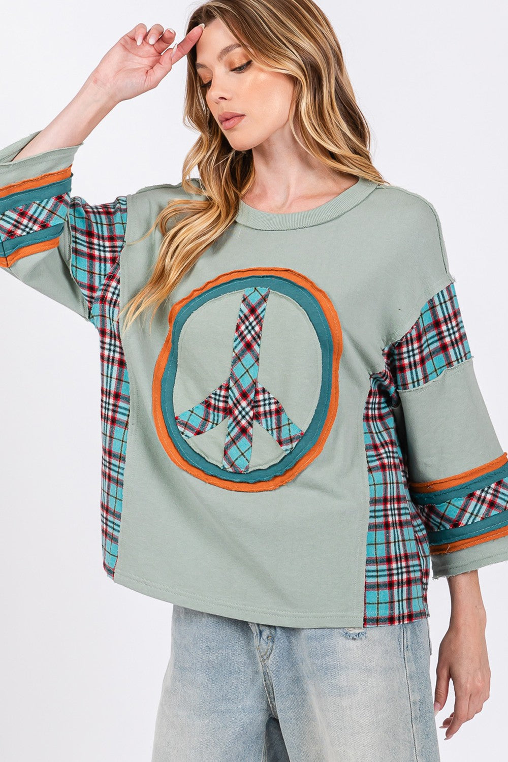 Ariana® | SAGE + FIG top with peace appliqué patch and contrast check