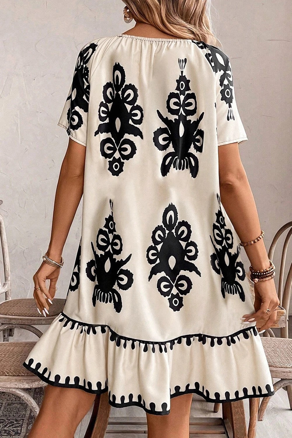 Dayana® | Apricot-colored, loose mini dress with ethnic print and ruffled hem