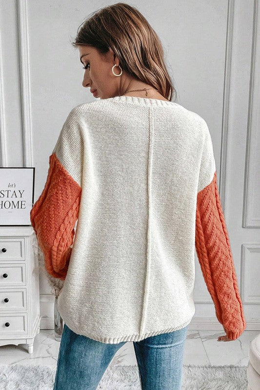 Antonia® | Women's color block sweater with patch pockets on the shoulder