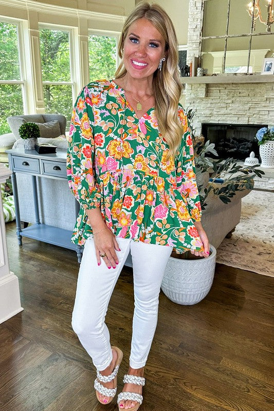 Dorotea® | Green floral peplum blouse with puff sleeves and V-neck