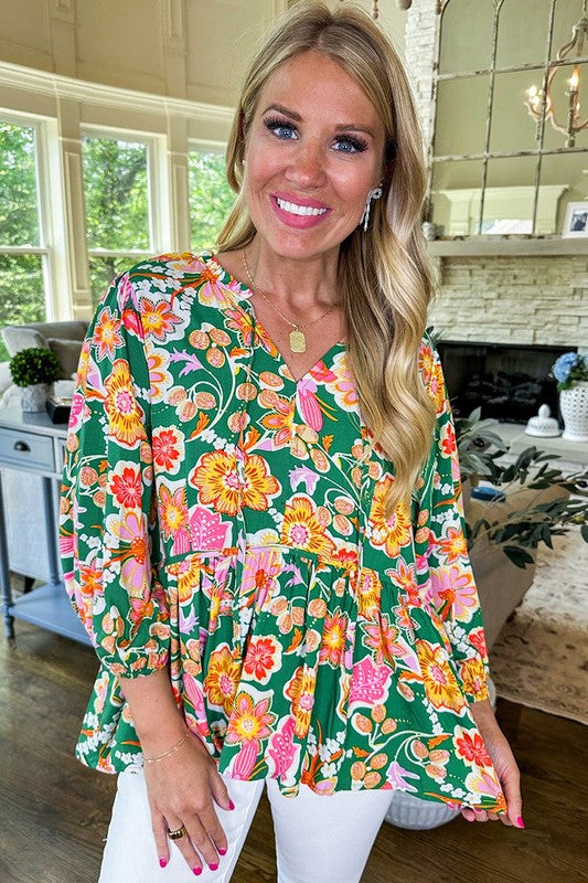 Dorotea® | Green floral peplum blouse with puff sleeves and V-neck
