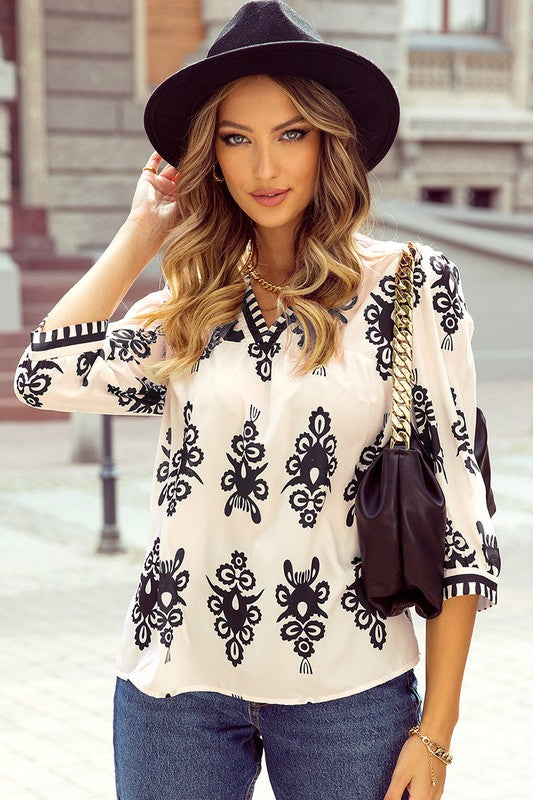 Cassia® | Geometric printed women's blouse with 3/4 sleeves and V-neck