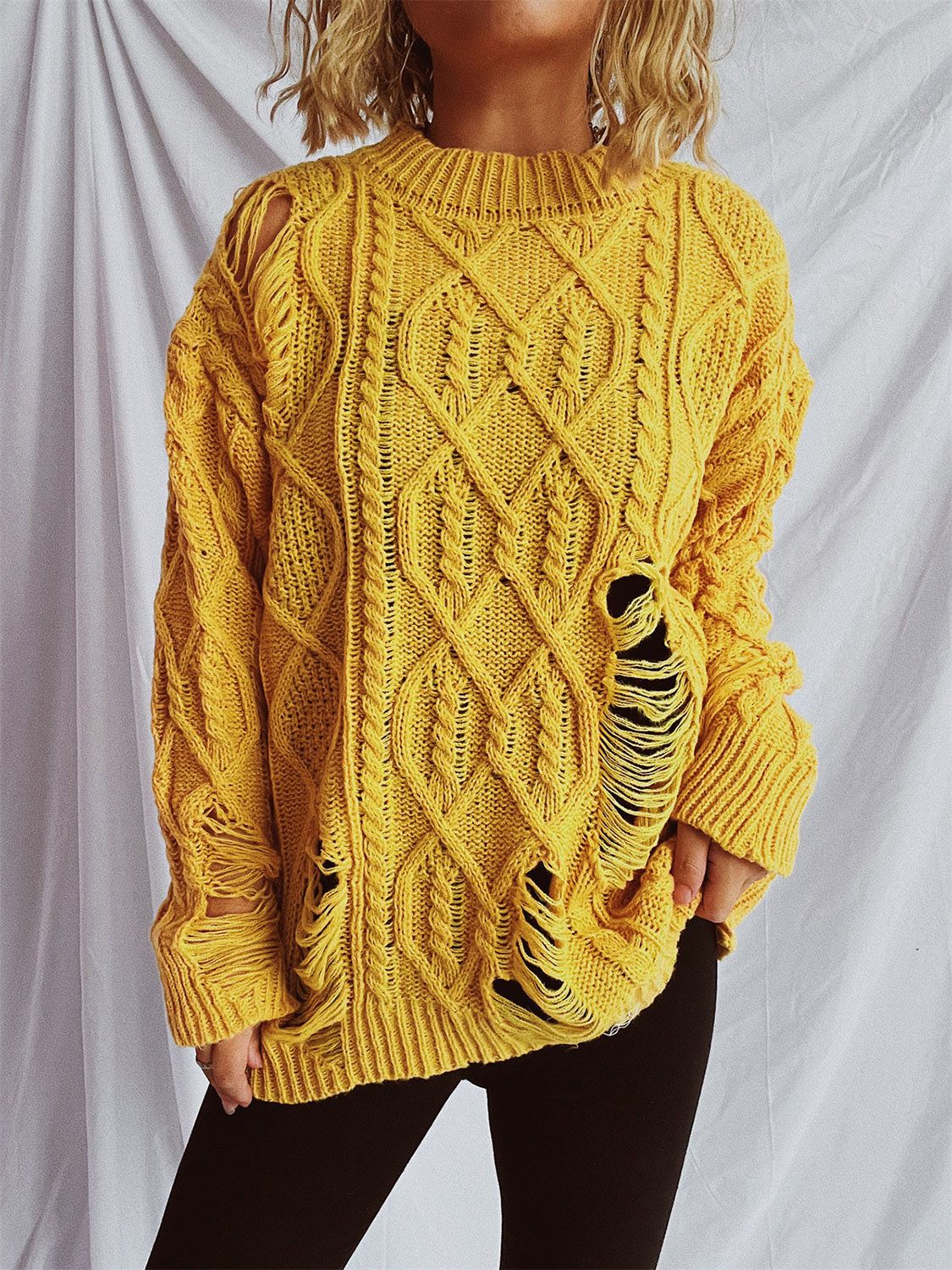 Clara® | Long-sleeved, crew-neck, distressed cable-knit sweater