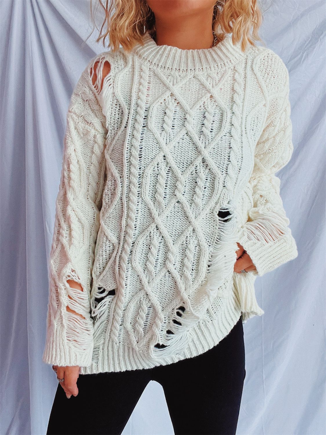 Clara® | Long-sleeved, crew-neck, distressed cable-knit sweater