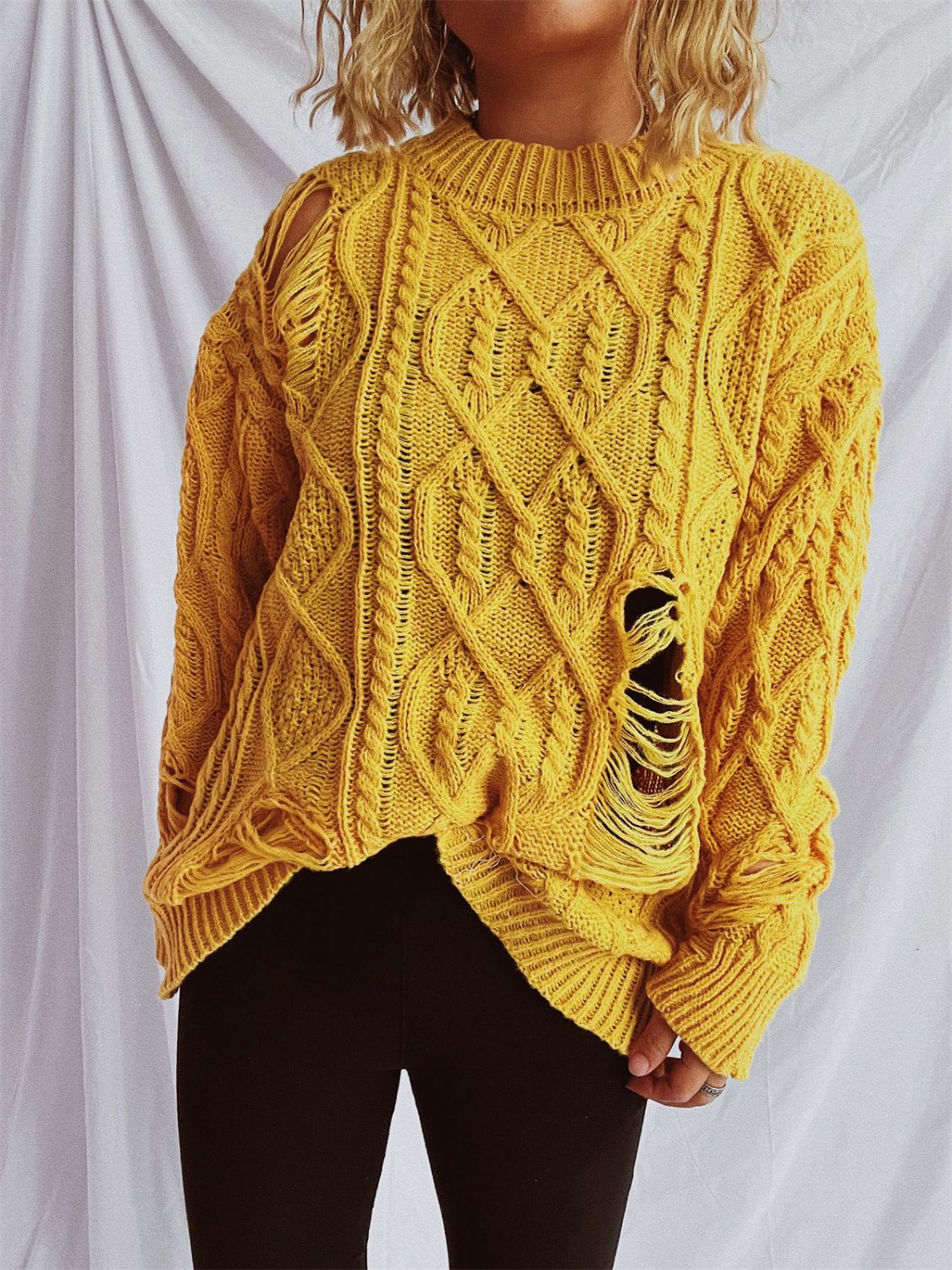 Clara® | Long-sleeved, crew-neck, distressed cable-knit sweater