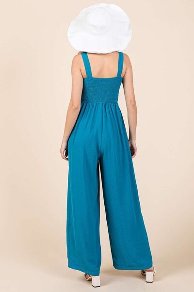 Alina® | Smocked jumpsuit with wide straps and wide legs