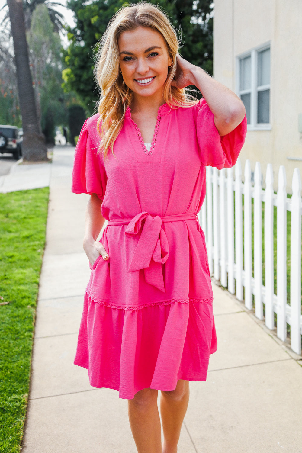 Briar® | Fuchsia mini dress with a notched neckline, balloon sleeves and a sash belt