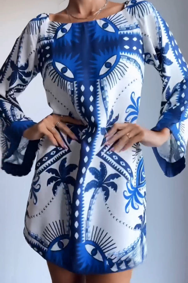Ava® | Blue mini dress with Mysterious Eyes print
