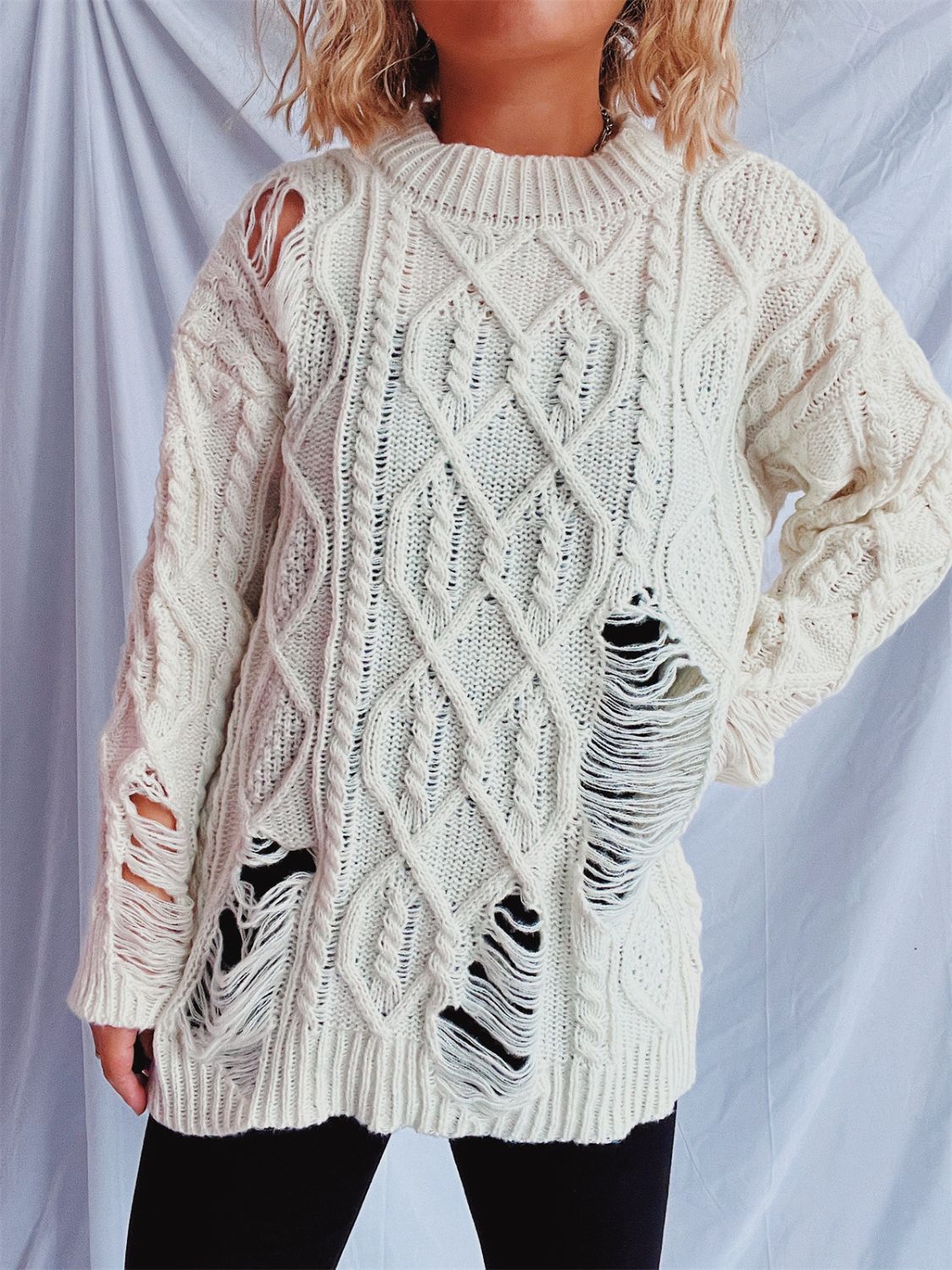 Clara® | Long-sleeved, crew-neck, distressed cable-knit sweater