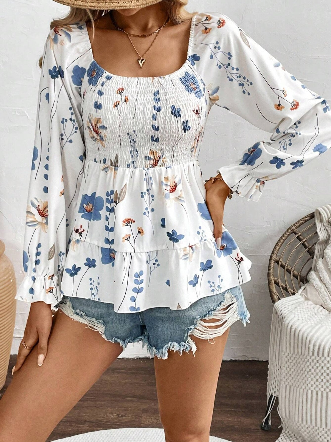Celia® | Smocked floral blouse with a scoop neckline and flounced sleeves