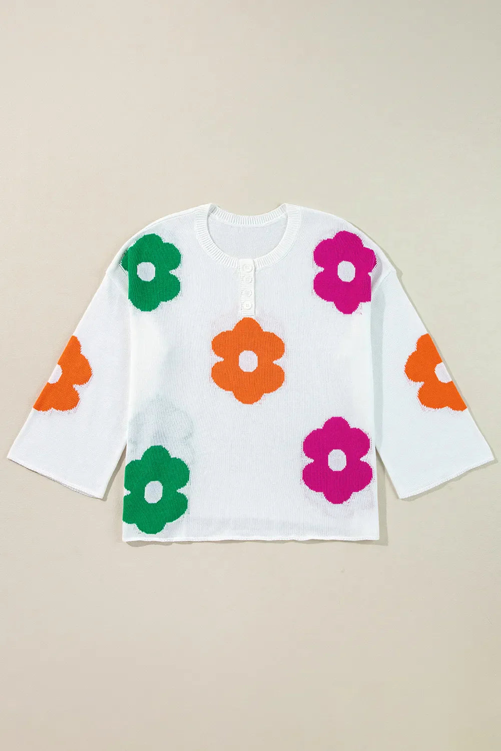 Delia® | Floral knit top with a crew neck and quarter buttons