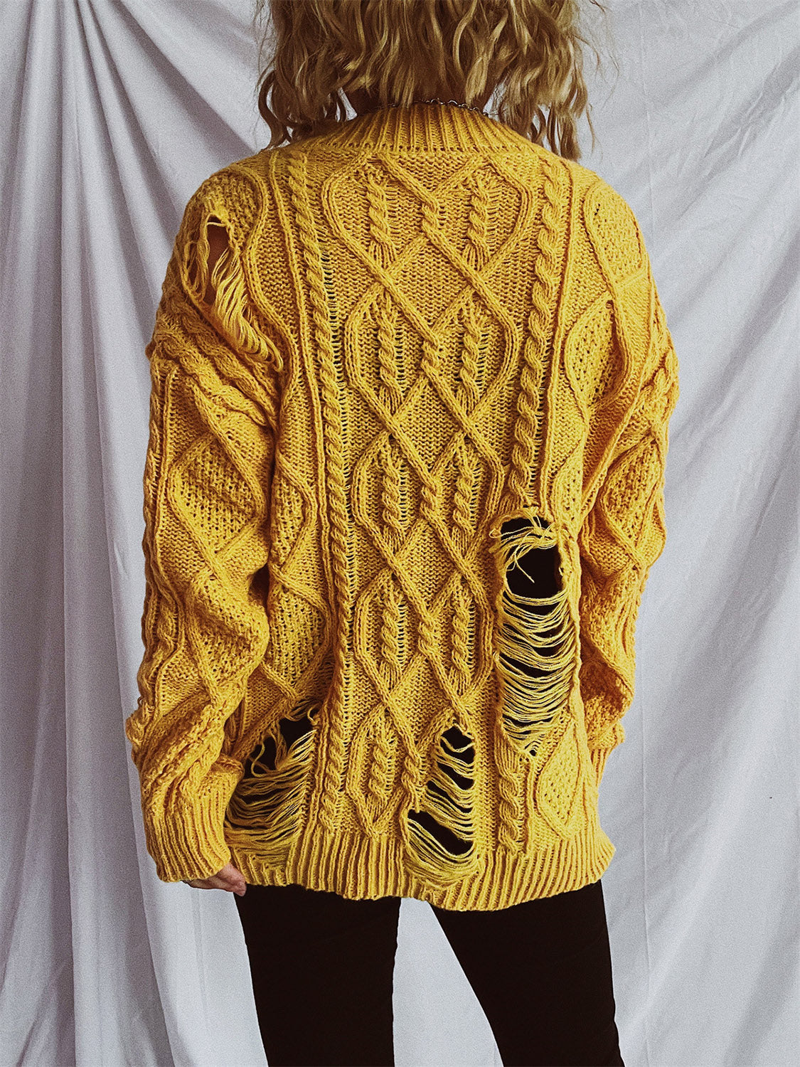 Clara® | Long-sleeved, crew-neck, distressed cable-knit sweater