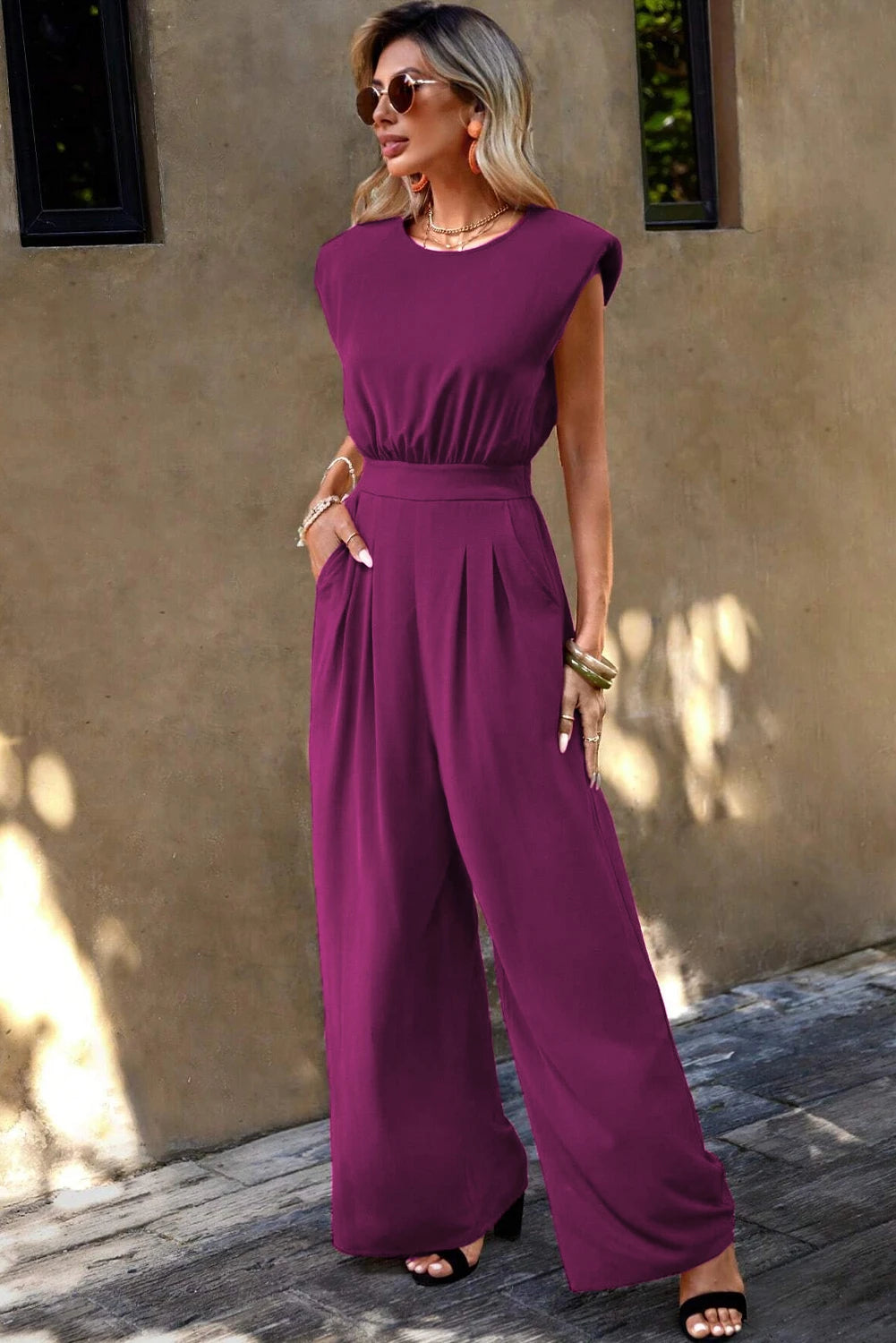 Elisa® | Pink jumpsuit with padded shoulders, slanted pockets and wide legs