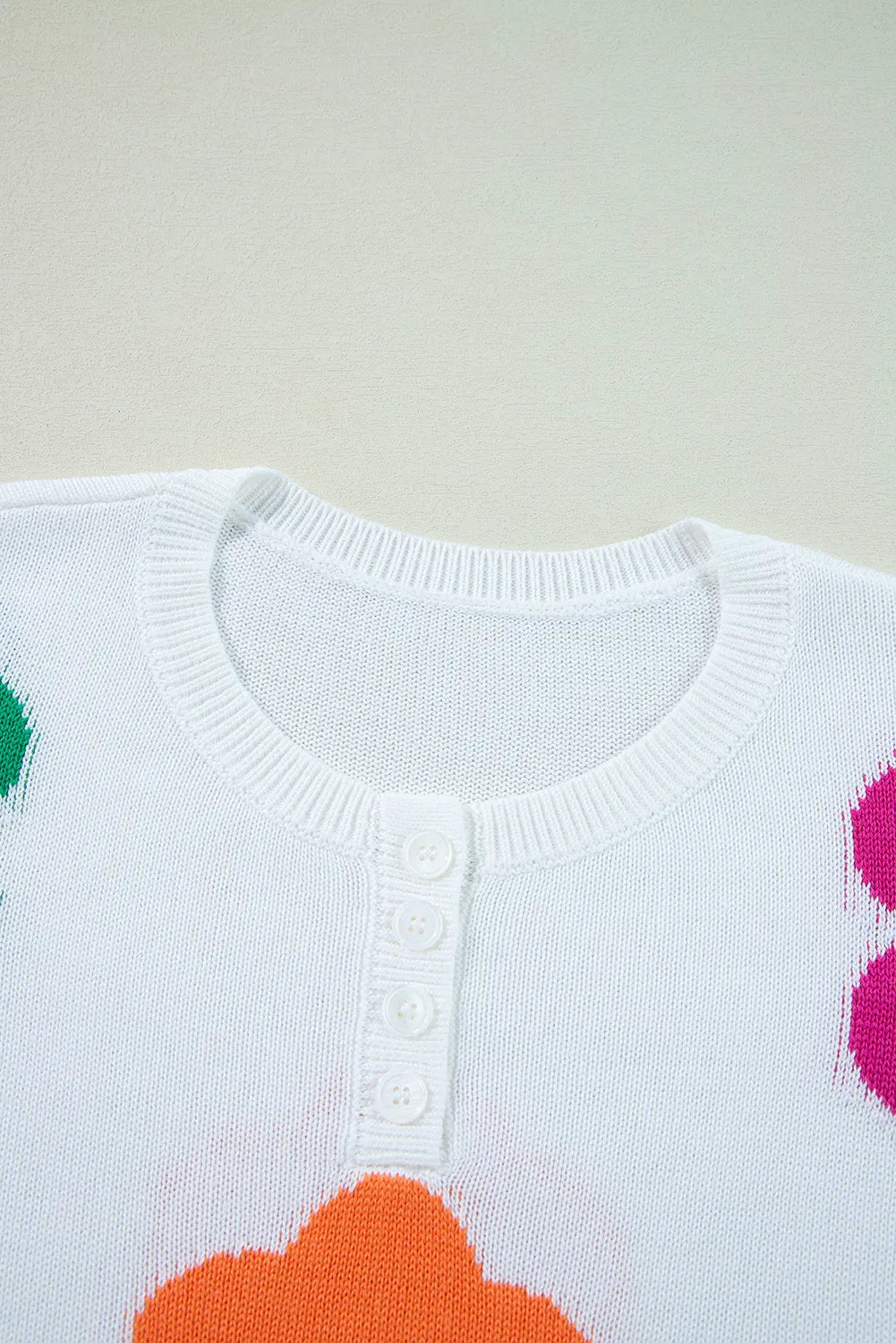 Delia® | Floral knit top with a crew neck and quarter buttons