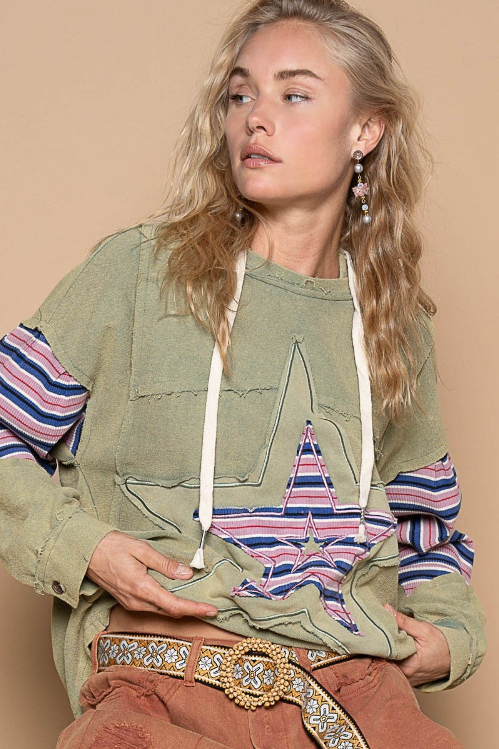 Carla® | French terry hoodie with star patchwork and raw edges