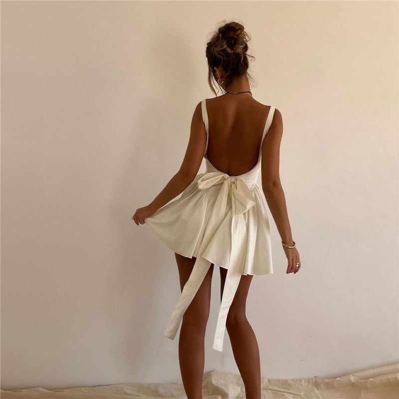Rose | Elegant white mini dress with backless design and pleated skirt for spring and summer