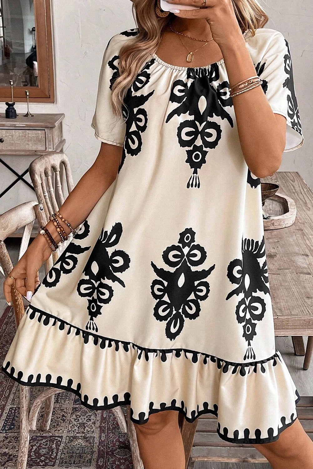 Dayana® | Apricot-colored, loose mini dress with ethnic print and ruffled hem