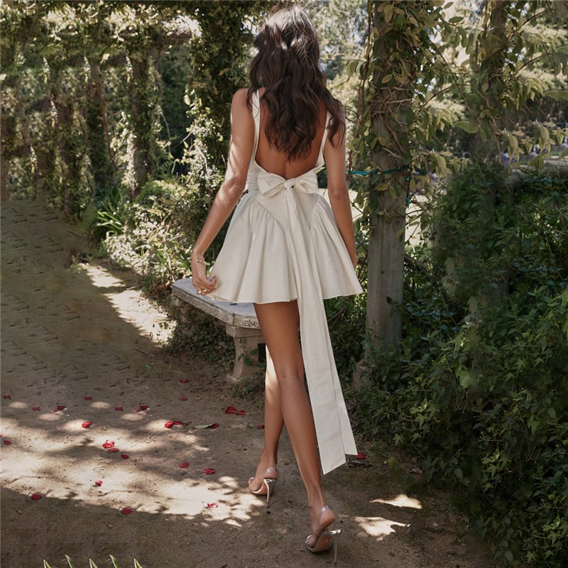 Rose | Elegant white mini dress with backless design and pleated skirt for spring and summer