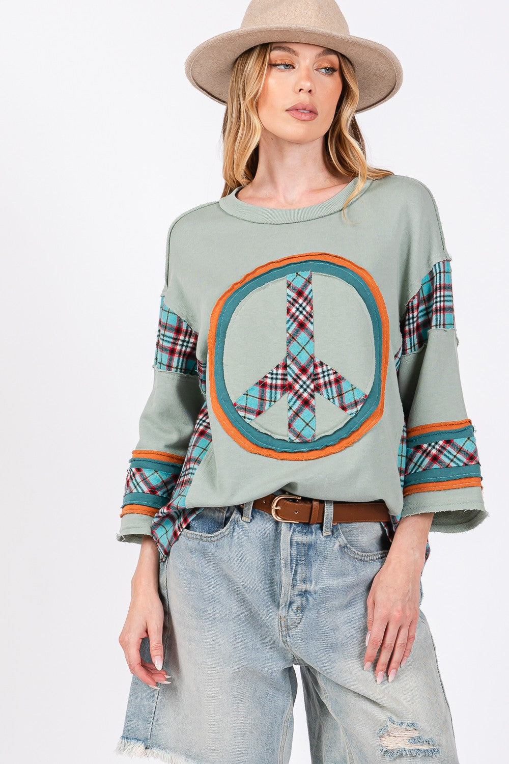 Ariana® | SAGE + FIG top with peace appliqué patch and contrast check