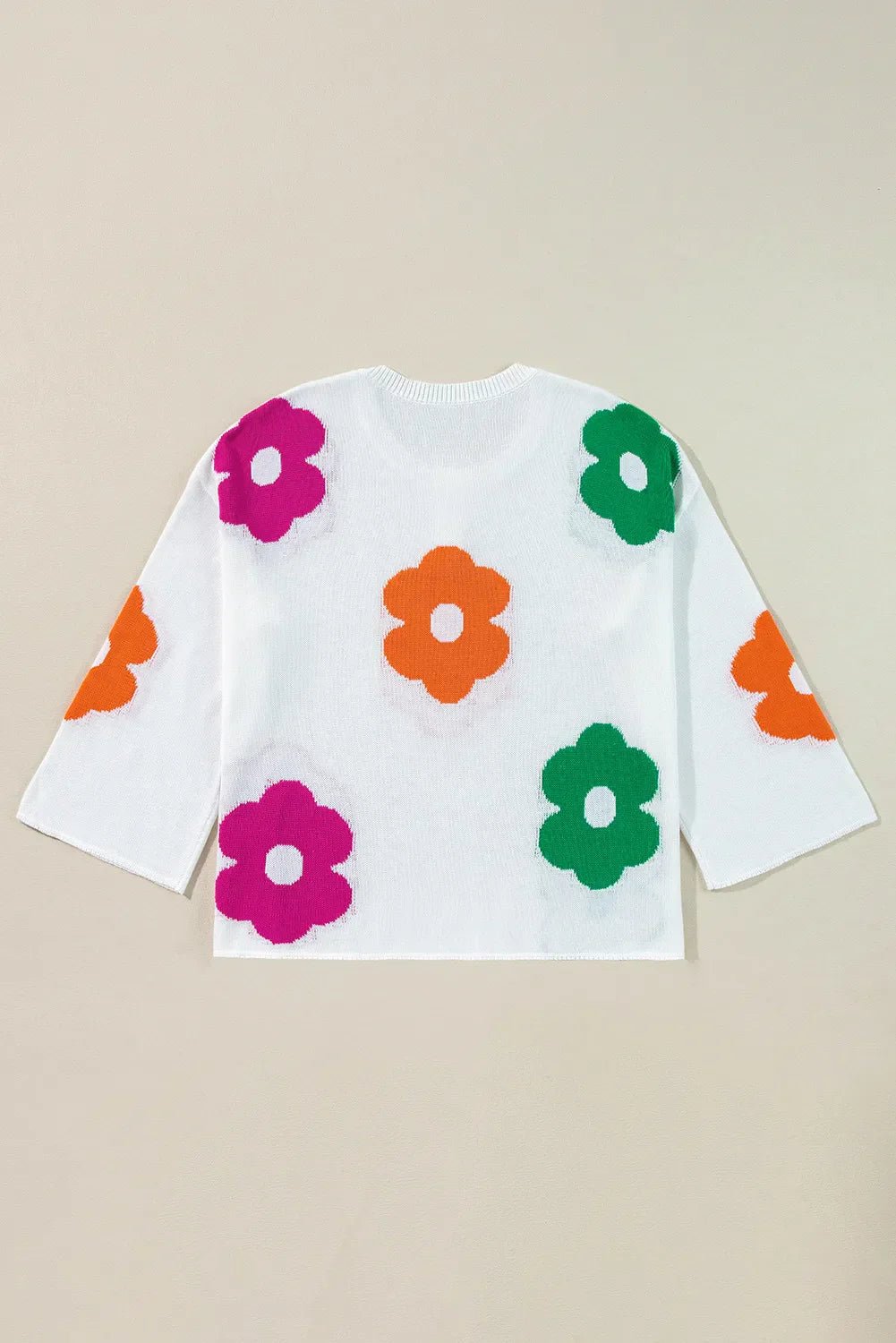 Delia® | Floral knit top with a crew neck and quarter buttons