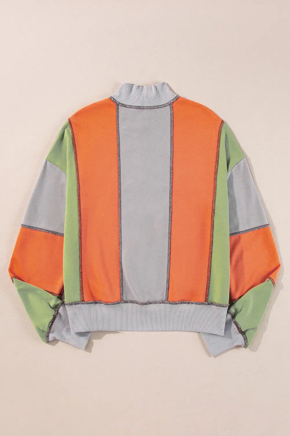 Andrea® | Full size long sleeve sweatshirt with exposed seams and color block pattern