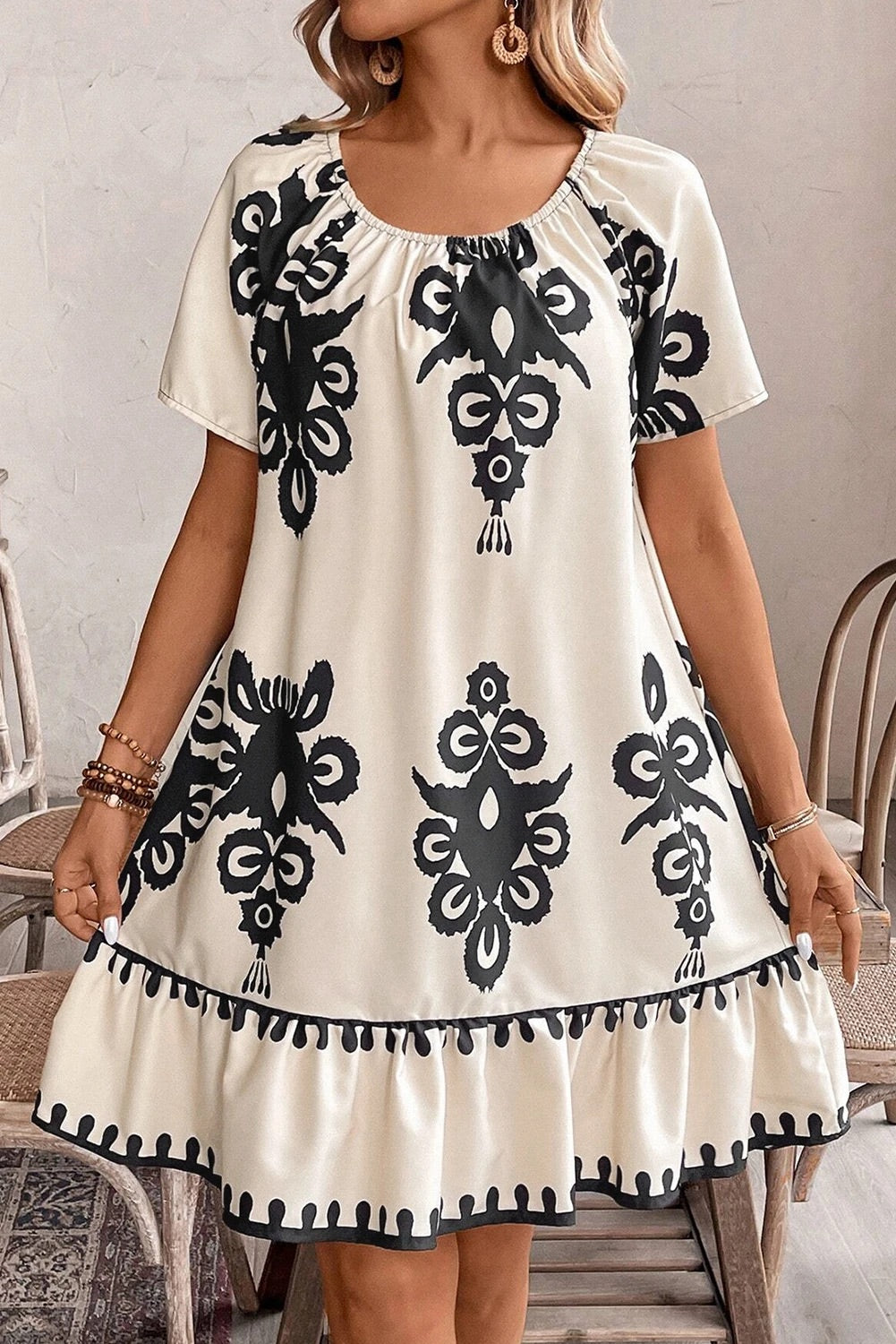 Dayana® | Apricot-colored, loose mini dress with ethnic print and ruffled hem