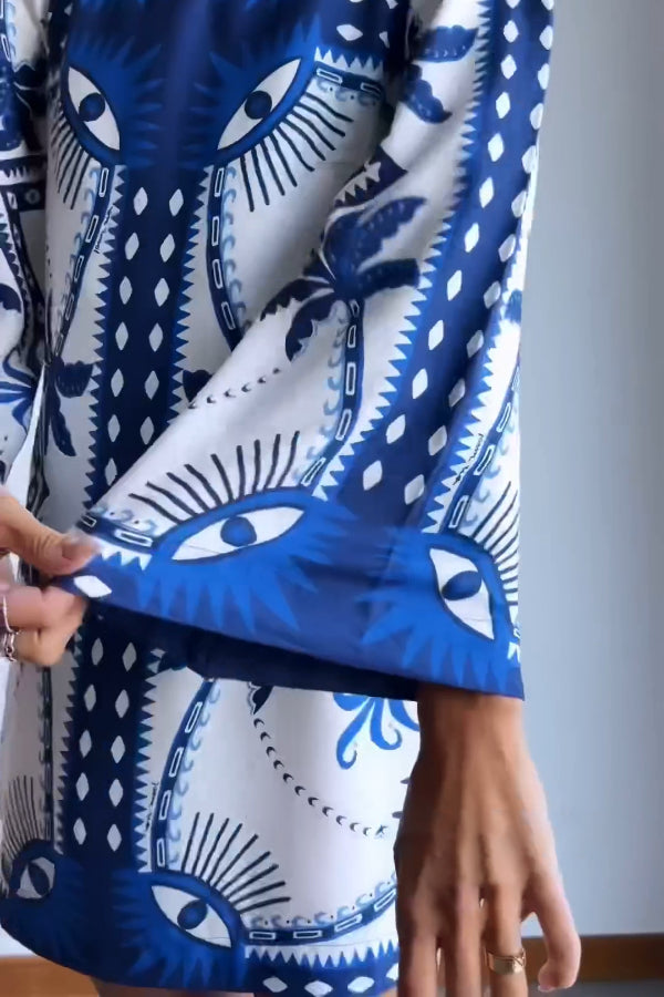 Ava® | Blue mini dress with Mysterious Eyes print