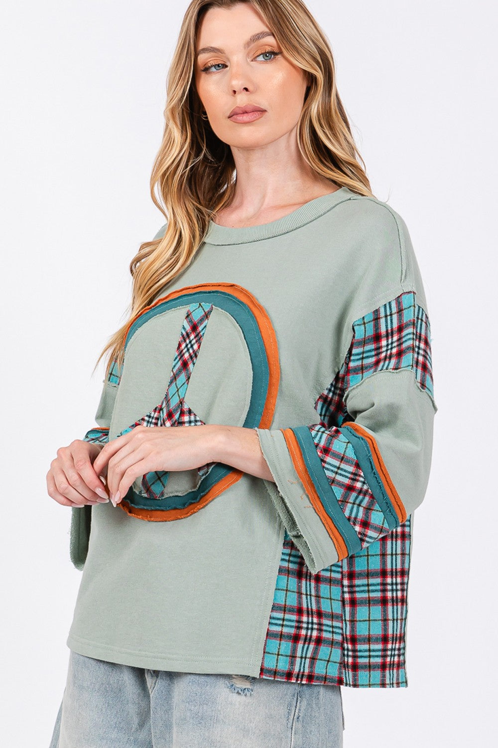 Ariana® | SAGE + FIG top with peace appliqué patch and contrast check