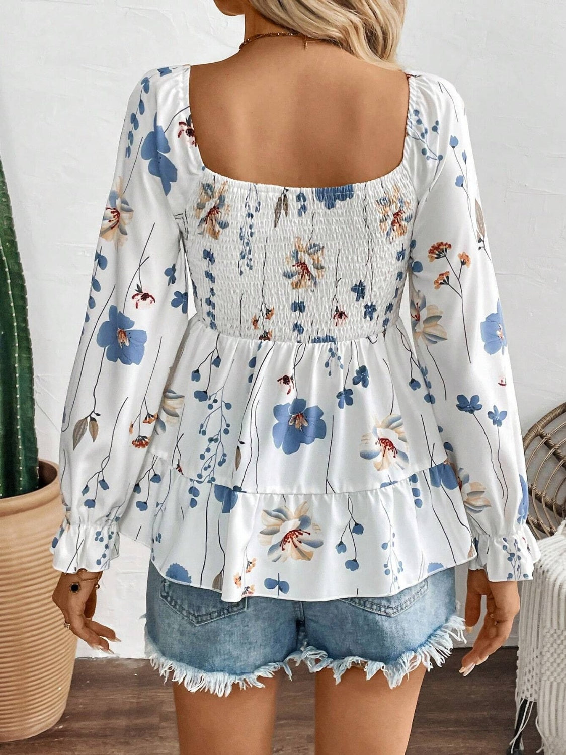 Celia® | Smocked floral blouse with a scoop neckline and flounced sleeves