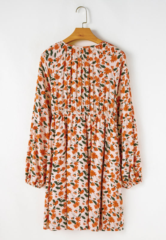 Amparo® | Smocked printed long sleeve dress with V-neck