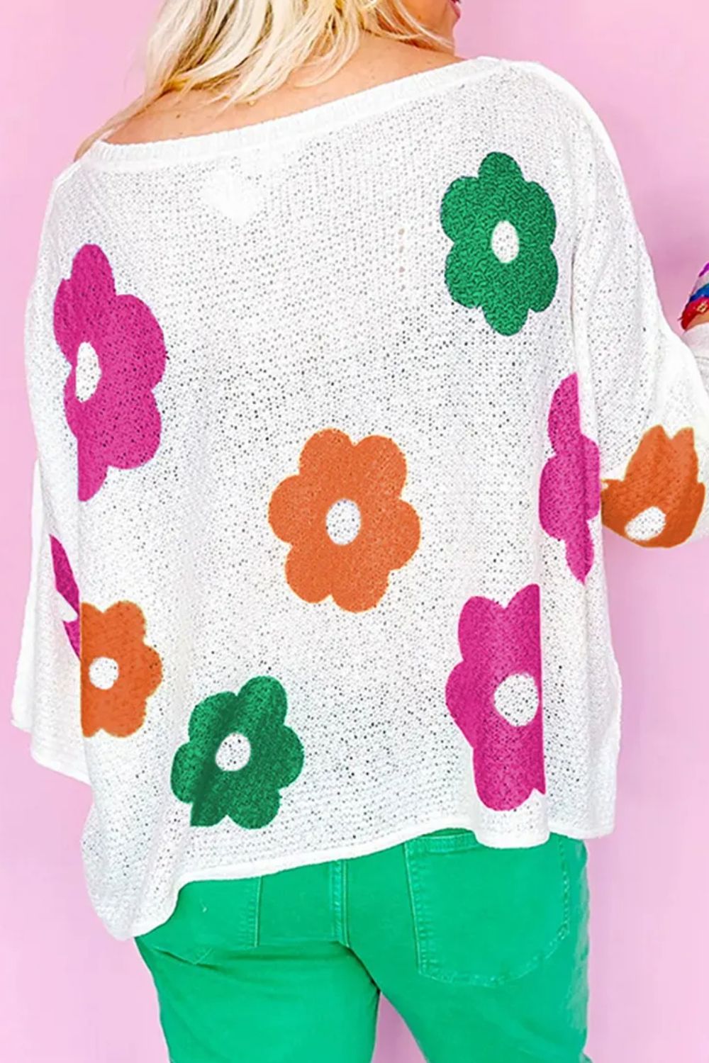 Delia® | Floral knit top with a crew neck and quarter buttons