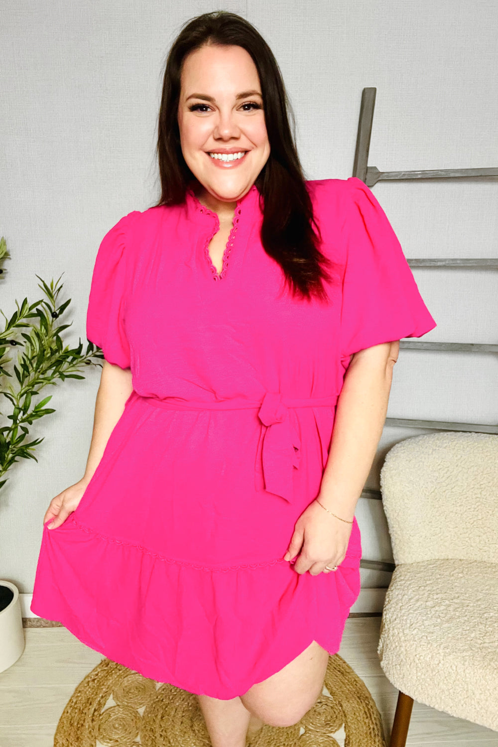 Briar® | Fuchsia mini dress with a notched neckline, balloon sleeves and a sash belt