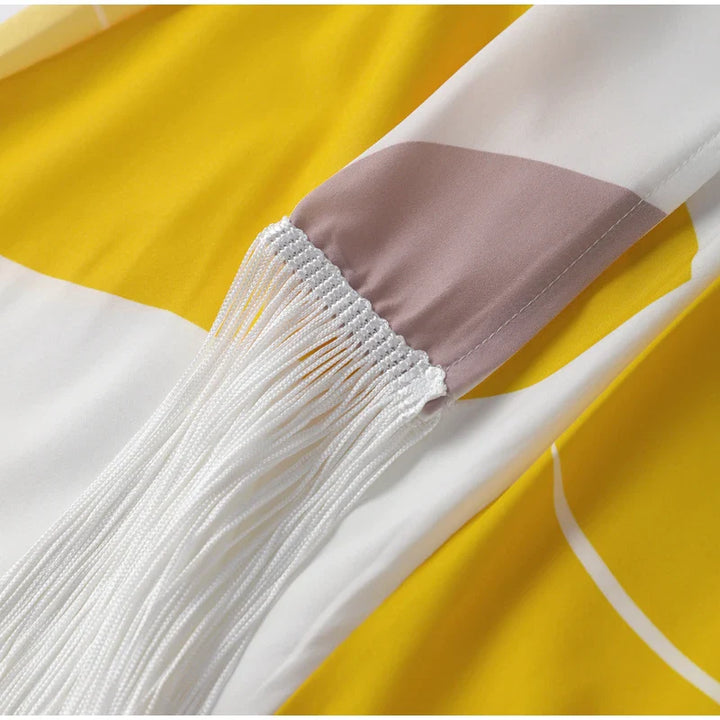Andrea® | Asymmetrical set with fringes and geometric print