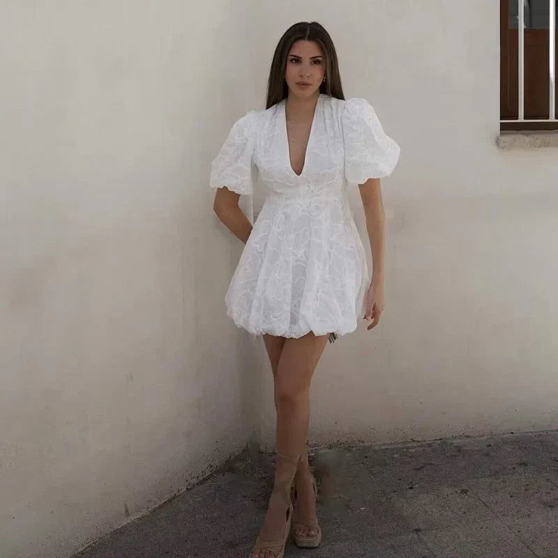 Claudia® | Elegant white mini dress with puff sleeves