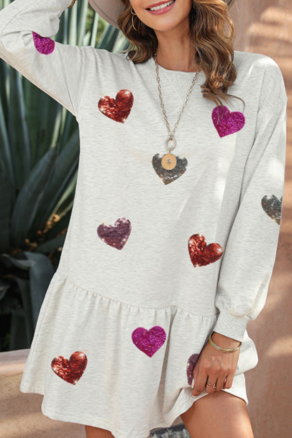 Andrea® | Long sleeve mini dress with sequins and a heart round neckline